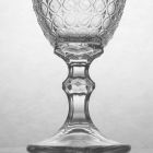 Verres à vin en verre transparent et décorations en relief, 12 pièces - Aperi Viadurini