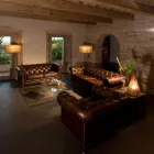 Fauteuil de Salon en Cuir Vintage Effet Vieilli avec Roulettes et Accoudoirs - Stamp Viadurini