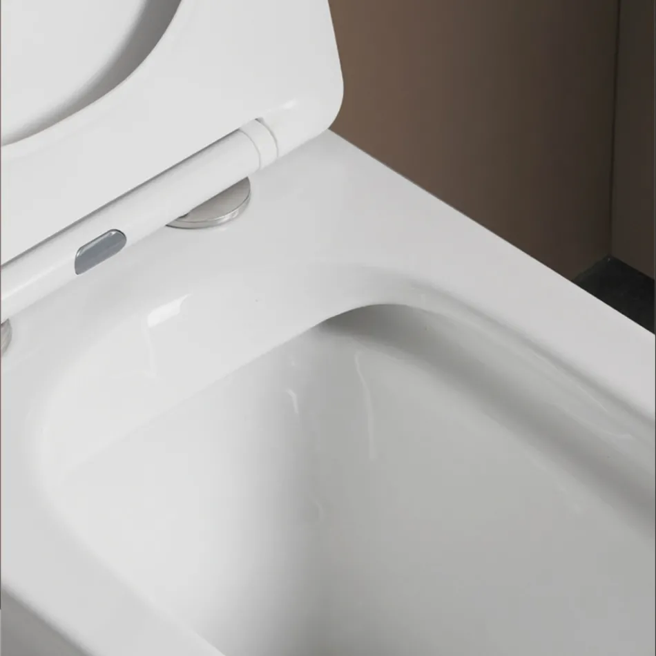 WC suspendu avec abattant en céramique à fermeture ralentie et design moderne - Giunco Viadurini