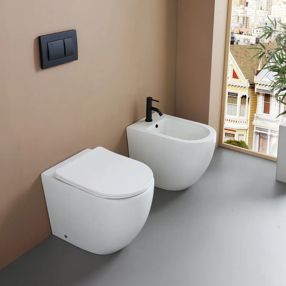 WC suspendu avec abattant à fermeture ralentie en céramique blanche - Elm Viadurini