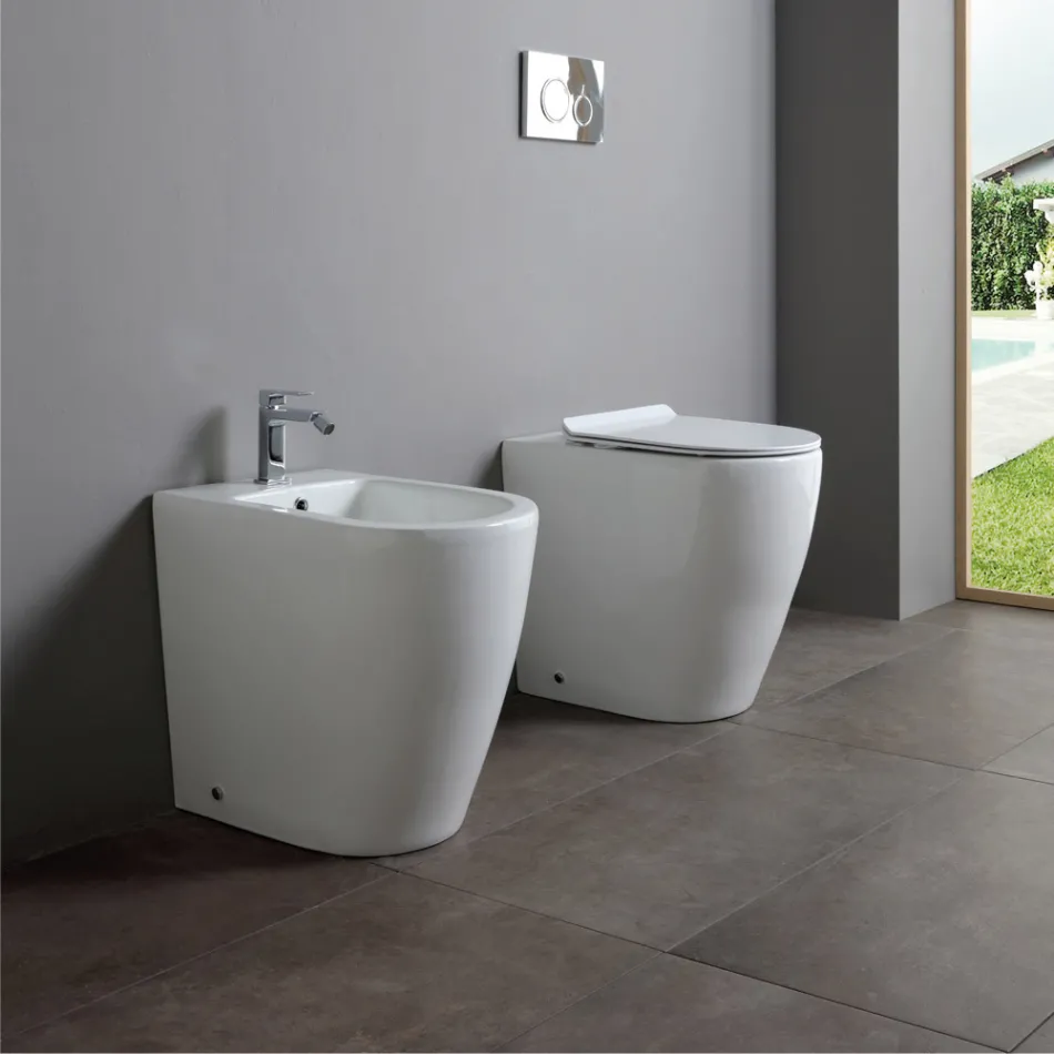 Toilettes en céramique Oleander avec bonde coulissante et siège à fermeture amortie Viadurini