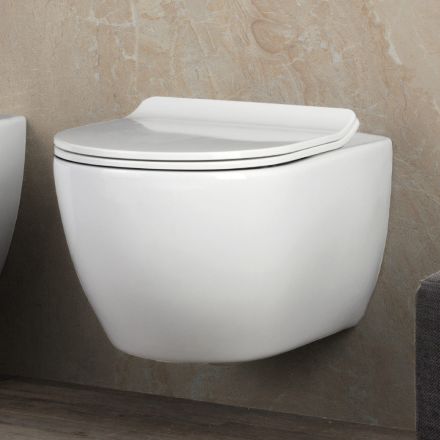 Toilette suspendue sans bride en céramique blanche Aster avec siège à fermeture amortie Viadurini