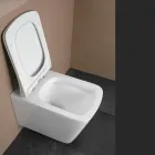 WC suspendu avec abattant en céramique à fermeture ralentie, design moderne - Giunco Viadurini