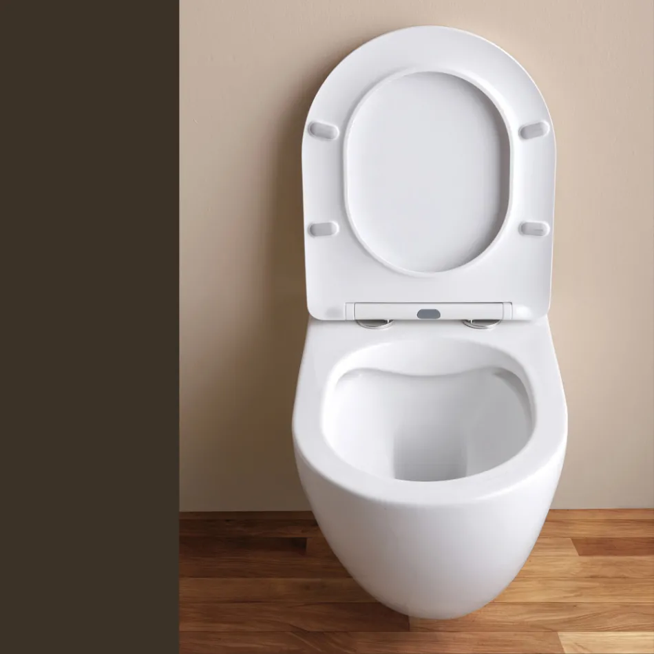 WC suspendu sans bride avec abattant en céramique à fermeture amortie - Genévrier   Viadurini