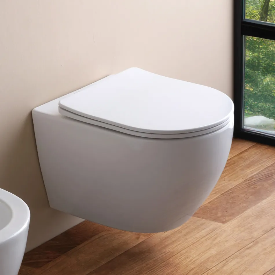 WC suspendu sans bride avec abattant en céramique à fermeture amortie - Genévrier   Viadurini